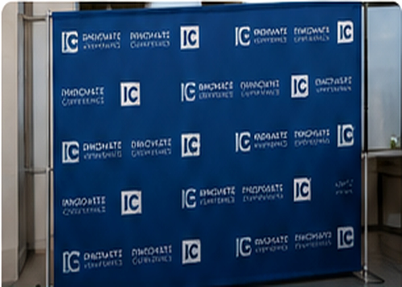 Blue corporate step and repeat wall at a business event