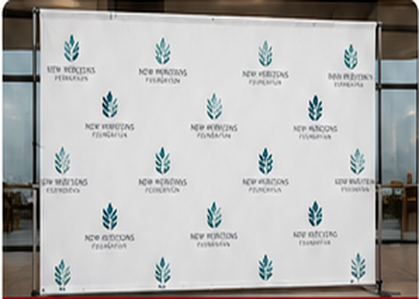White sponsor backdrop prepared for a gala and fundraiser